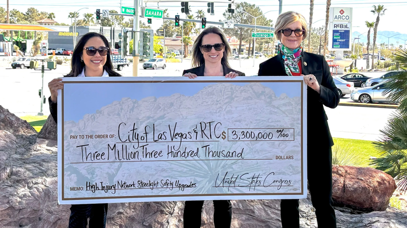 From left to right: RTC Deputy CEO Angela Castro, Las Vegas Director of Public Works Joey Paskey and Nevada Democratic US Rep. Susie Lee hold a celebratory check poster to announce $3.3 million in federal funding for local transportation projects on Friday, April 5, 2024, in Las Vegas. Phot credit: Casey Harrison