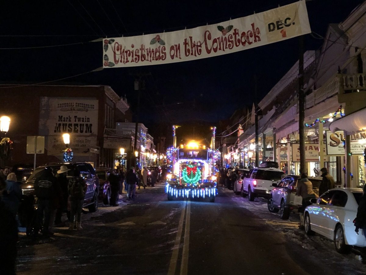 Truck decorated in holiday lights driving in Virginia City parade.