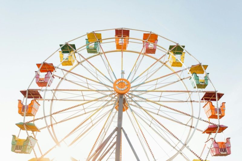 a colorful ferris wheel against the skyline